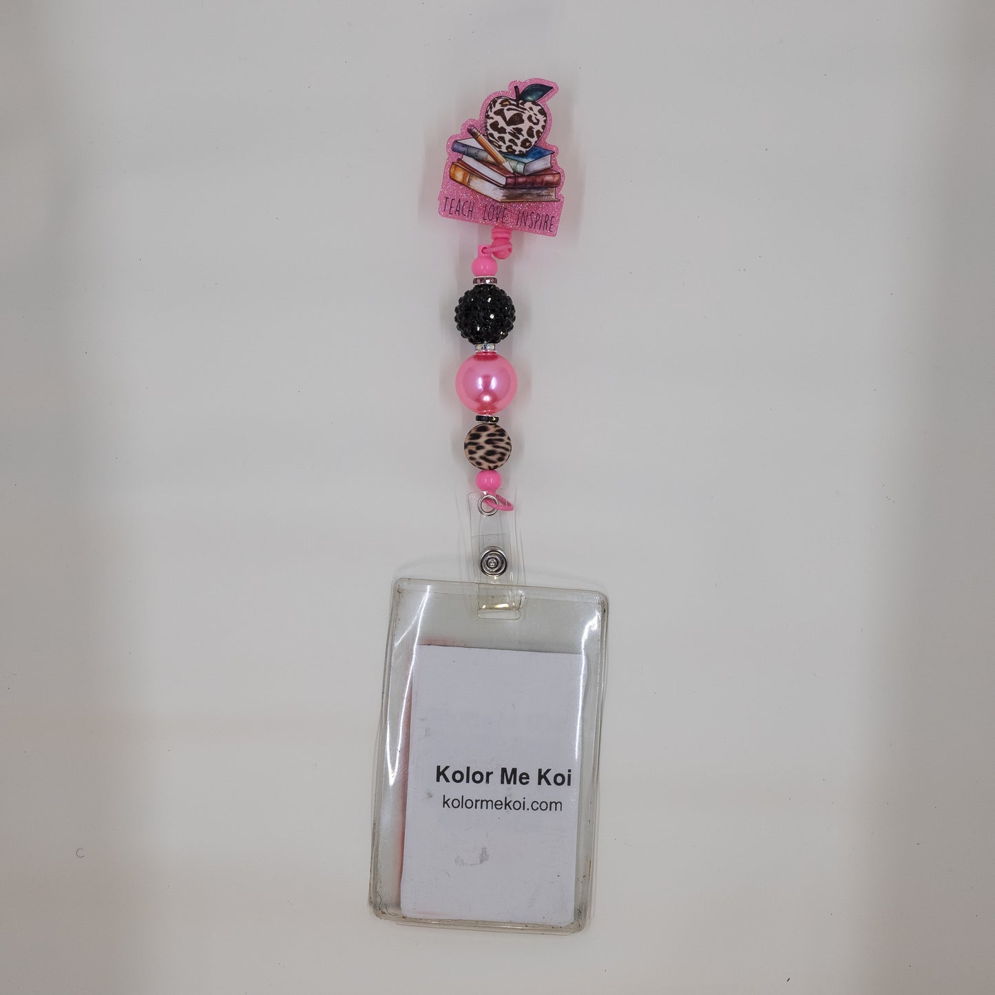 Pink apple badge reel